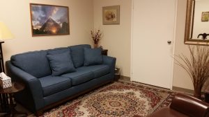 pasadena office meeting room grey sofa oriental rug picture on wall